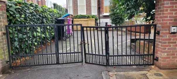 Sagging gate repair: metal swing gate with one leaf hanging lower than the other